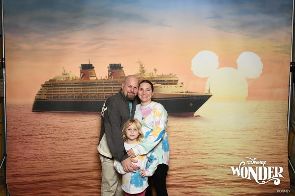 James, Kati, and Mia photo with Disney Cruise backdrop
