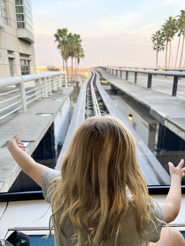 Mia on the airport tram to the airplane at Orlando International