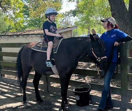 Bennett on a pony ride at Lawton Stables