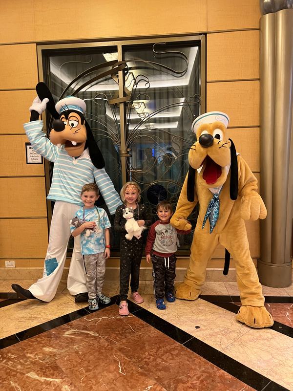 The kids with Goofy and Pluto on the Disney Wonder