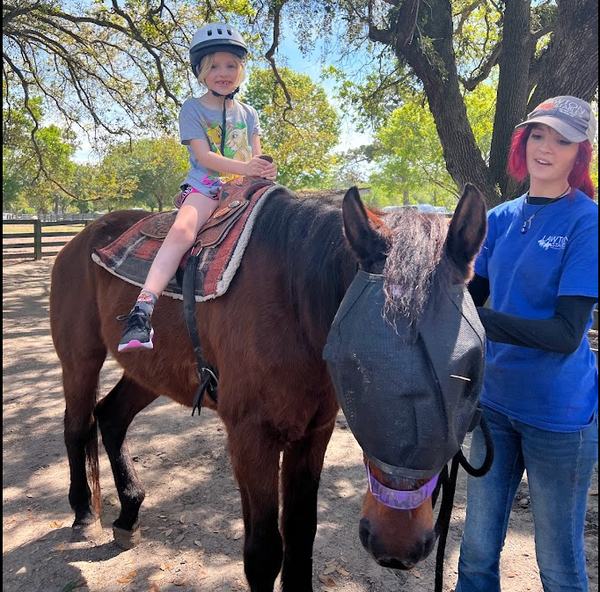 Mia on a pony ride at Lawton Stables